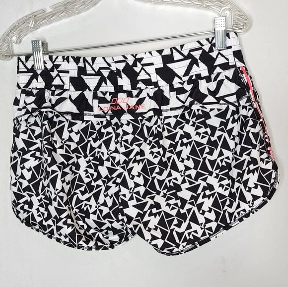 Lorna Jane running shorts. Pink side zippers. Built in shorts. Size XS. - Picture 3 of 11
